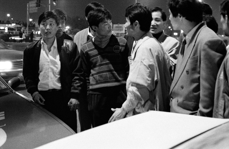 young men at night, Shanghai 1995