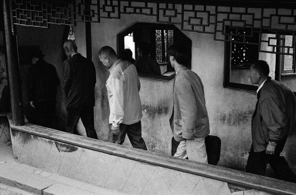 men in a line, Shanghai 1995